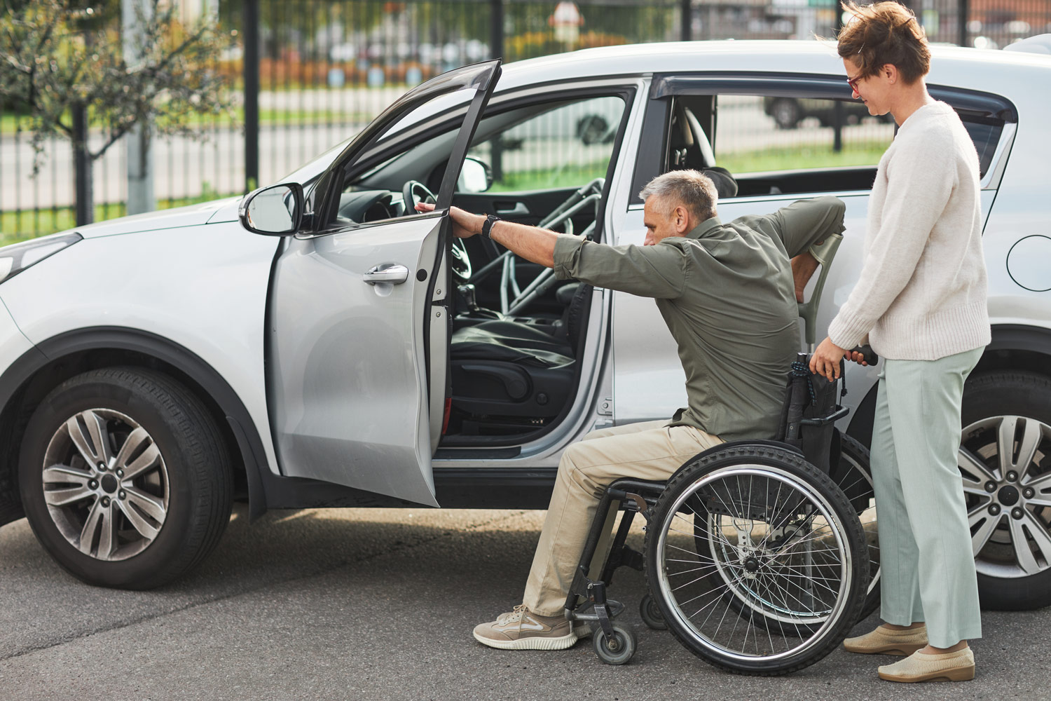 man-in-wheelchair-getting-in-car-2021-12-09-15-20-12-utc